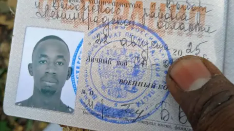 David Kuloba în echipament militar